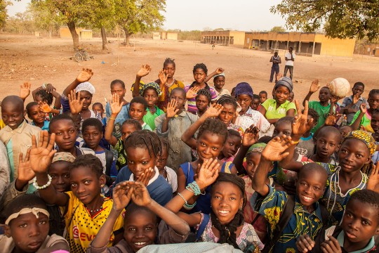 African children waving and smiling